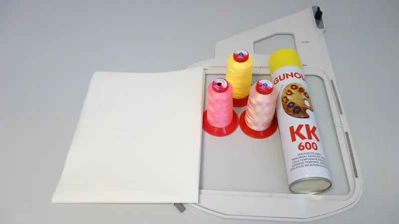 DIY Fringe Flowers T-Shirt Design: A Step-by-Step Embroidery Tutorial 3 materials, including a pre-washed and ironed T-shirt, stabilizer, adhesive spray, embroidery threads, and a hoop