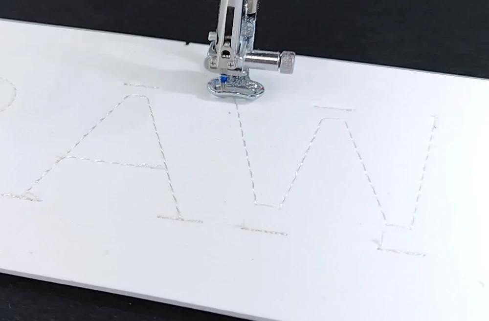 How to Elevate Your 3D Foam Embroidery with Custom Textured Patterns 25 the embroidery machine laying down the 8-pass edge stitches over the white foam